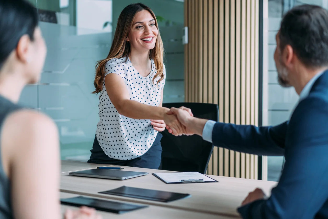 Business professionals shaking hands on a corporate training partnership agreement