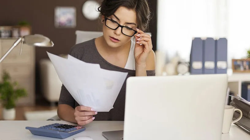Professional focused on document review and task management illustrating the benefits of Sarden Learning Personal Efficiency Program